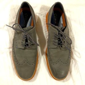 Men’s gray dress shoes with orange bottoms